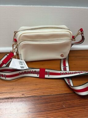 lululemon athletica Cream Crossbody Bag with Red Strap